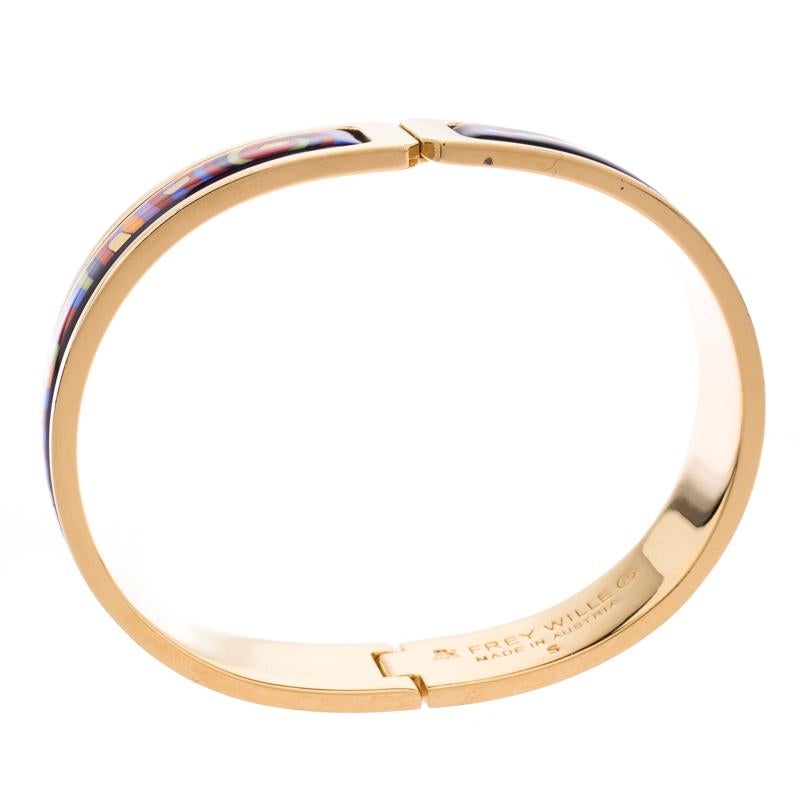Frey Wille’s ‘Hommage à Hundertwasser Spiral of Life’ is designed with a lot of thought and has a deep rooted design philosophy. The ballerina bracelet in gold-tone is embellished fire enamel details all over. Style your looks with this meaningful