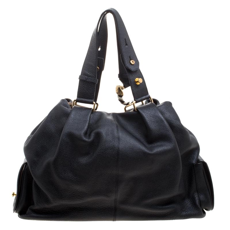 This Leoni satchel from the house of Bvlgari is crafted in a supple and durable black leather and accented with gold-tone hardware. It comes fitted with two top handles, that can be adjusted to the desired drop. Carry yours for day to day
