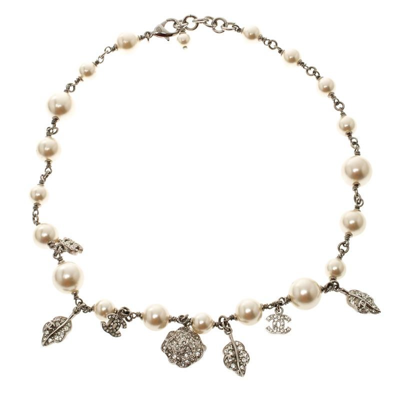 Subtle, elegant and dainty neckpieces like this Chanel piece works for all occasions. It is beautifully designed with a silver-tone chain and detailed crystals, faux pearls and charms. It is secured with a lobster clasp closure and can be adjusted