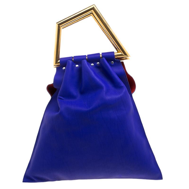 Handbags are more than just style statements. This Celine creation is crafted from black leather and is functional. The open triangle bag comes with dual handles, a zip pouch and a spacious interior that will hold all your belongings. The bag was