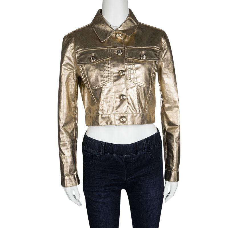 Just add this stunning Moschino long sleeve jacket over even the simplest tops to instantly make it party ready. Constructed in shiny gold tone cotton blended fabric, this piece of clothing features gold tone button down front, along with flap