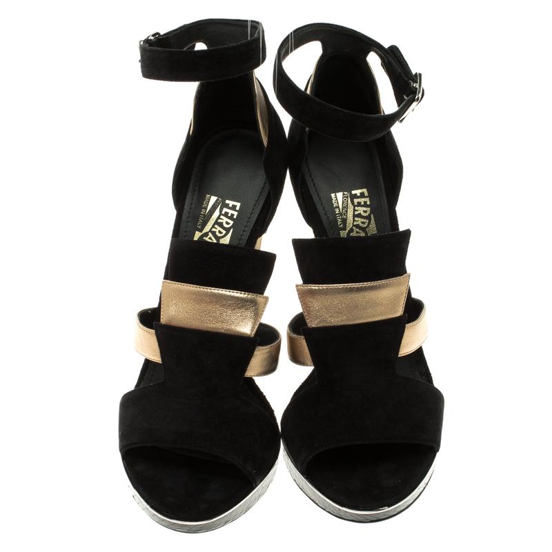 A perfect piece for the parties and the evening occasions, this Salvatore Ferragamo Lexus platform sandal will instantly stand out each time you wear it. With a black suede and gold leather body, the heel on this shoe features a telescope shape