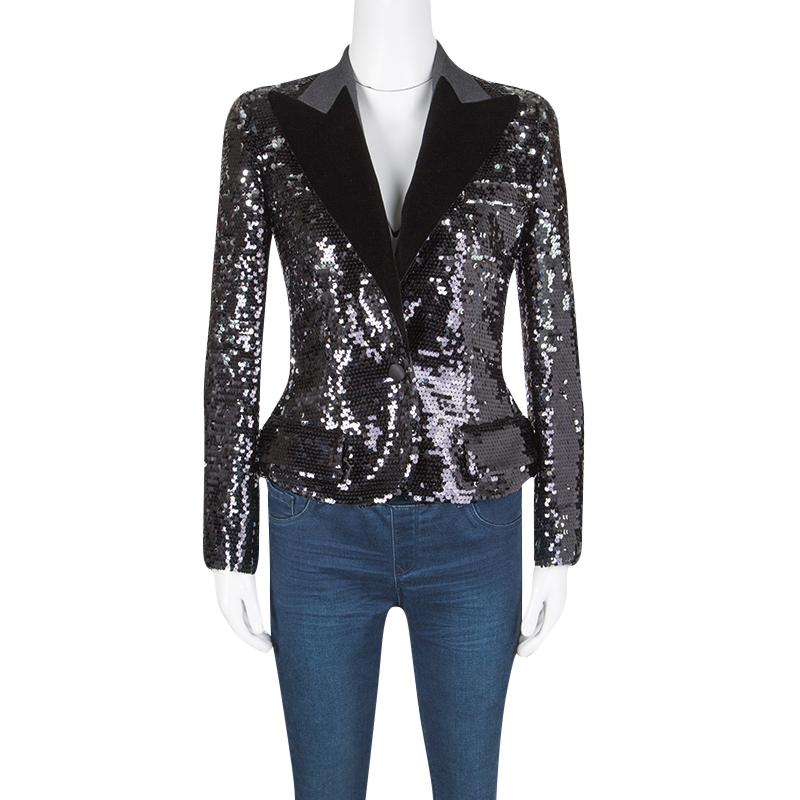 Adding a statement piece of clothing to your look can instantly transform it from casual to glam and this Dolce and Gabbana blazer is one such eye catching addition to your collection. This beautiful black blazer is completely embellished with black