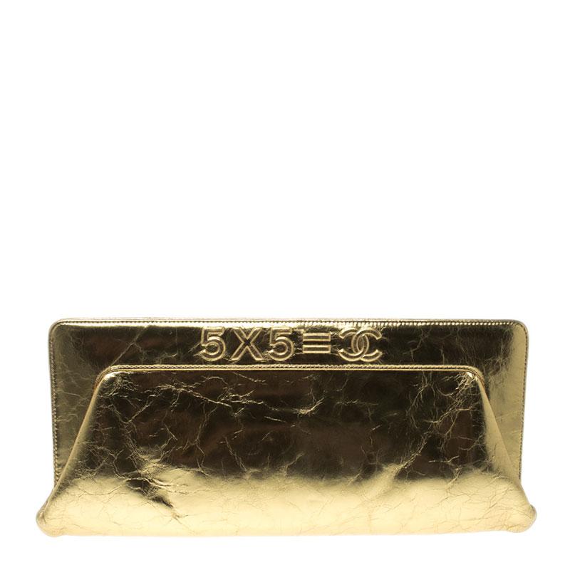 Dazzle the night as you step out with this fabulous Chanel clutch in a stunning gold leather. The top of the bag is embossed: 