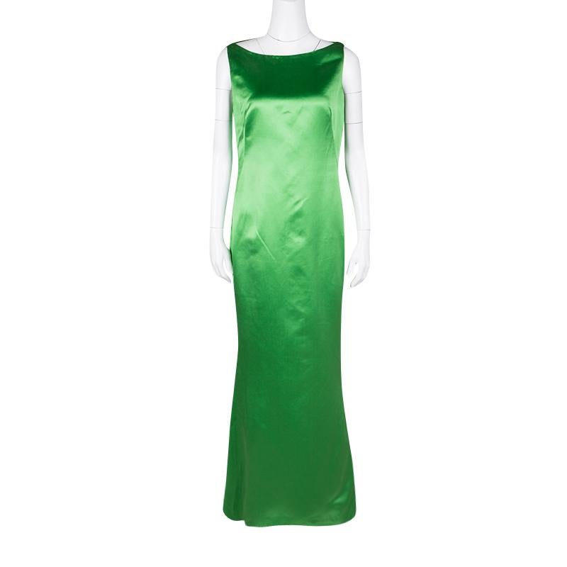 Timelessly elegant and minimally chic, this beautiful Alexander McQueen sleeveless maxi dress is sure to steal the show at those evening and formal occasions. Designed in green silk fabric, this dress features a wide boat neckline along with a sleek
