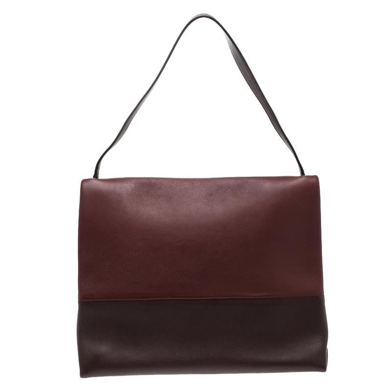 With a spacious design that can fit all that you need through the day along with a sleek and smart design, this Celine All Soft tote bag is sure to replace your favourite everyday bag. Crafted in marron and burgundy leather, this bag features a