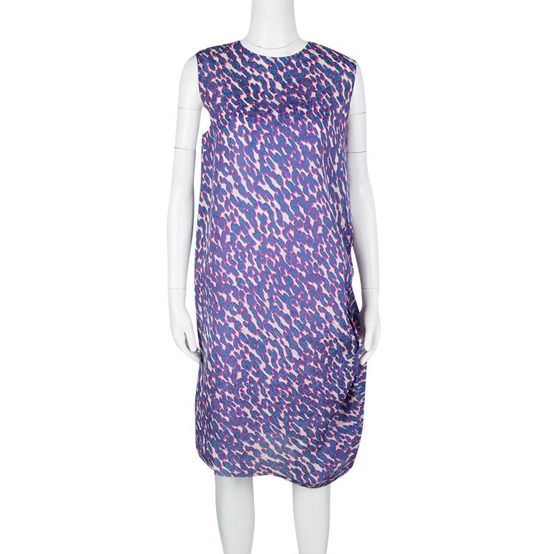 The Lanvin Multicolor Animal Printed Silk Frayed Hem Pleat Detail Sleeveless Dress is a unique and gorgeous piece to include in your wardrobe. The chic sleeveless dress is of mid length and comes with a rounded neck and a straight fit body with a