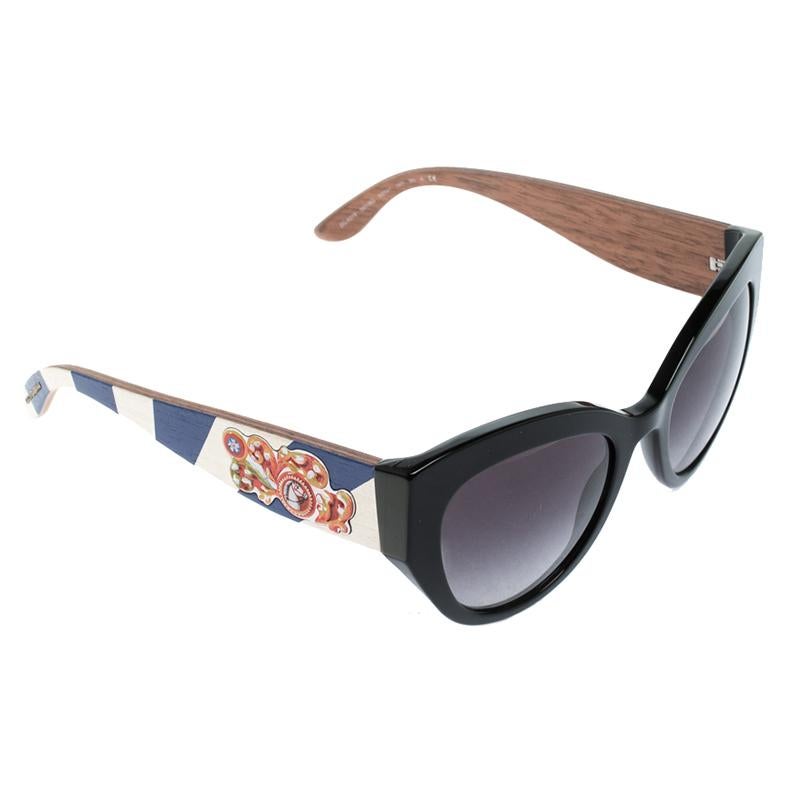 A fashionista like you deserves the best, like these sunglasses from Dolce&Gabbana. Styled to eloquently express your personal style, these sunglasses carry a cat eye shape with Sicilian Carretto prints on the temples. While its design will make you