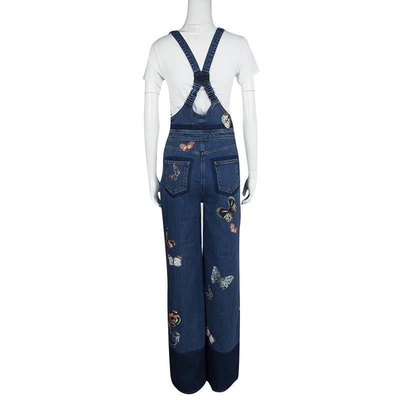 Valentino brings forth the latest trends of the season is a chic design with this denim over-all that are perfect for your casual wardrobe. Showcasing cute butterflies that are embroidered on its surface for a refreshing an colorful look, these