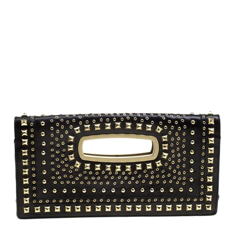 Featuring a never-out-of-style flap closure, this chic clutch from the house of Jimmy Choo is luxuriously adorned with sparkling studs at exude an aura of stylish grace to your evening ensemble. The black leather construction is perfect for pairing