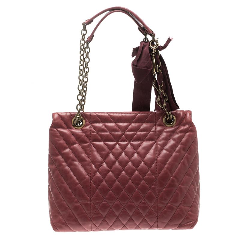 Accessorize your outfit to perfection with the Lanvin shoulder bag crafted in pure quilted lambskin leather with fabric lining and gold-tone hardware.This luxurious shoulder bag features a fold over flap with a twist lock; one main pocket, one