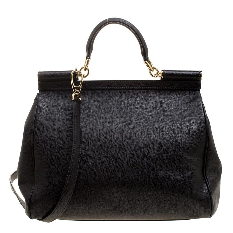 This gorgeous black Miss Sicily bag from Dolce and Gabbana is a handbag coveted by women around the world. It has a well-structured design and a flap that opens to a compartment with fabric lining and enough space to fit your essentials. The bag