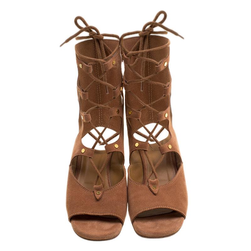 Catch everyone's glances with these gladiator sandals from Chloe. They've been wonderfully crafted from suede and styled with open toes, laces, and comfy wedges. They'll look great with casual wear.

Includes: The Luxury Closet Packaging



