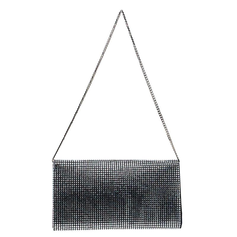 With this glitzy clutch, you can really express your unique style. It is covered in crystals and designed with DG on the flap. The clutch has a nylon interior and it is held by a shoulder chain. Be it an evening party or just a Sunday outing with