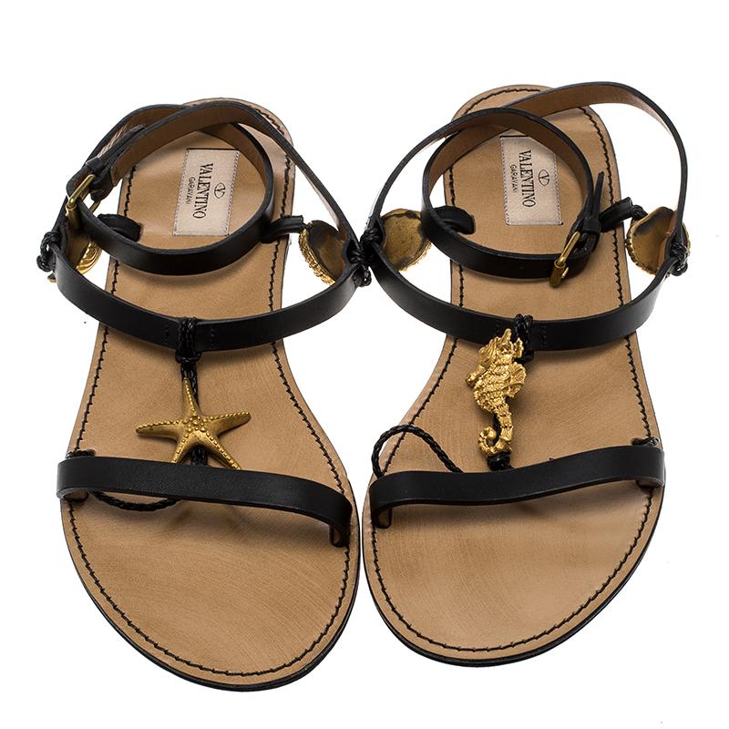 How can one not fall in love with these sandals by Valentino! They've been beautifully crafted from leather and detailed with shells and a starfish on one of the vamps and a seahorse on the other. The sandals carry comfortable insoles and ankle
