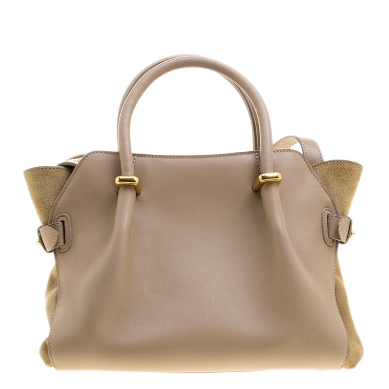 This noteworthy polished bag, crafted with leather and suede, does dual work as a fashion adornment and factual necessity. Flaunt your rich fashion taste with this Marche tote from Nina Ricci. Whether it is a casual evening or a night out with your