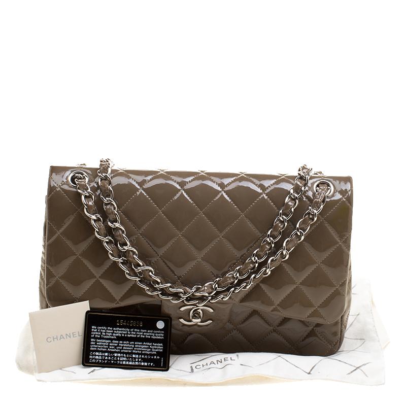 Chanel's Flap bags are the most iconic handbags. The classic double flap bag is crafted from patent leather and features the iconic quilted pattern. It has a chain and leather interwoven strap along with a CC twist lock closure in silver tone. The