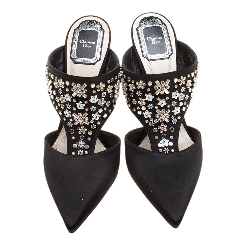 Nothing like a fabulous pair of slides to brighten up a day! These Dior slides are made from black satin and designed with pointed toes and 11 cm heels. But what makes these slides so desirable are the beautiful embellishments on the uppers. This is