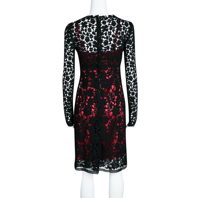 Dolce and Gabbana's dress is a winner outfit for evening outings. It is made of cotton with intricately embroidered lacework. This almost sheer black dress has a contrasting silk lining. It is completed with a zip closure at the rear. Perfect for