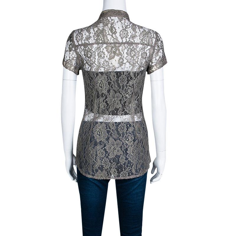 Dolce and Gabbana infuse their elusive artistry even in the most simple designs, and hence you enjoy them as much as you love their statement totes or floral dresses. This well-structured shirt is decorated with floral lace details overall. It is