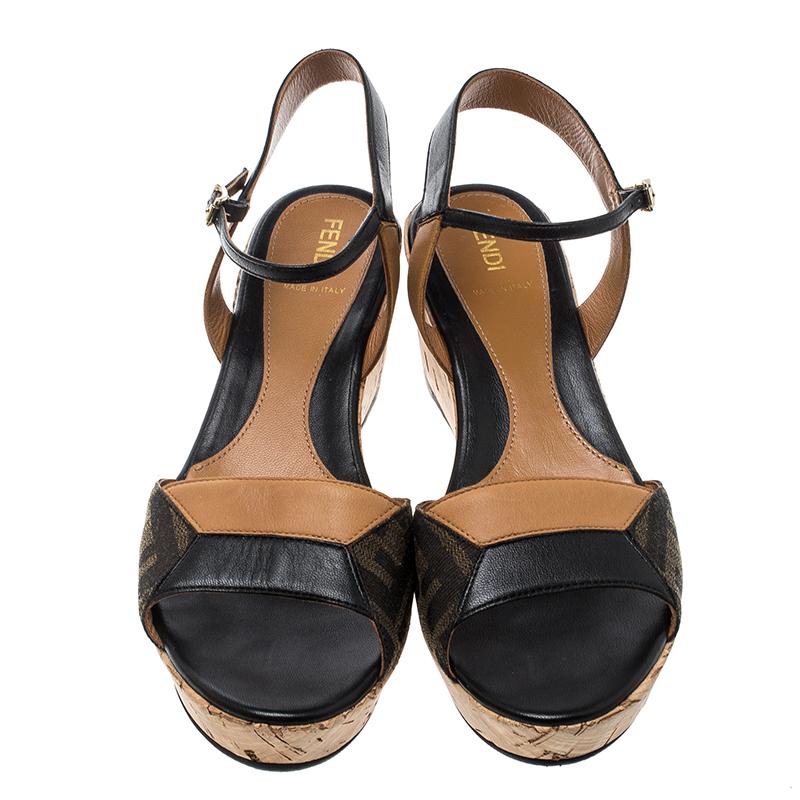 These wedge sandals from the collection of Fendi show extreme elegance when worn on a day-out. It features Zucca canvas and leather, promising great comfort and softness for the whole day long. Being secured with buckle closure, it is easy to wear