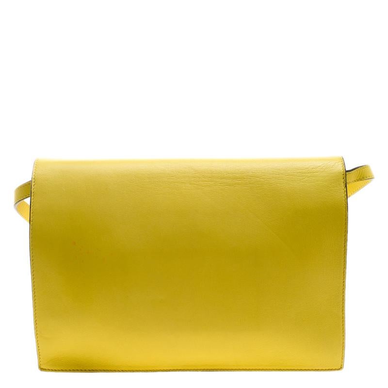 A perfect spring summer bag that can be worn through the day or even for parties, this Chloe shoulder bag will never fail to impress you. Crafted in yellow leather, this bag features gold tone bow detail at the front flap along with gold tone