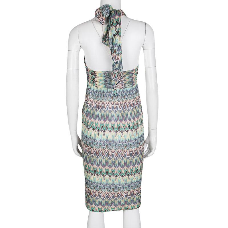 This dress from Missoni is here to make you look fashionably divine. Knit from quality fabrics, the dress has a halter neck with a tie detail and patterns in multiple colours splayed all over. You can wear it with a pair of espadrille wedge