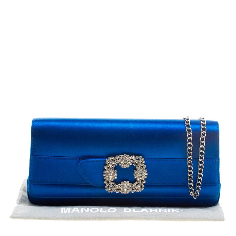 This Manolo Blahnik clutch simply floors us with its beauty. Wonderfully crafted from satin, this blue clutch is held by a chain and designed with a satin interior housing a zip pocket and a crystal buckle on the flap. High on appeal and