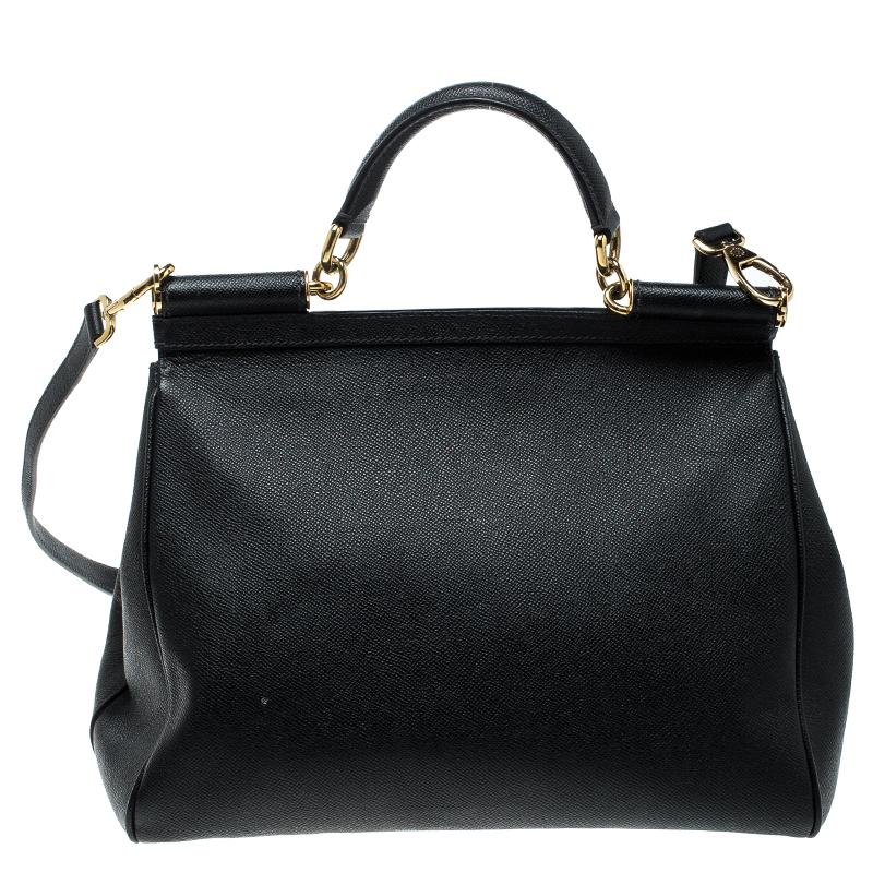 The Miss Sicily tote is one of the most celebrated creations from Dolce&Gabbana. The tote beautifully embodies the spirit of extravagance and feminity that the Italian luxury brand carries. Crafted from black leather, the bag has a structured design
