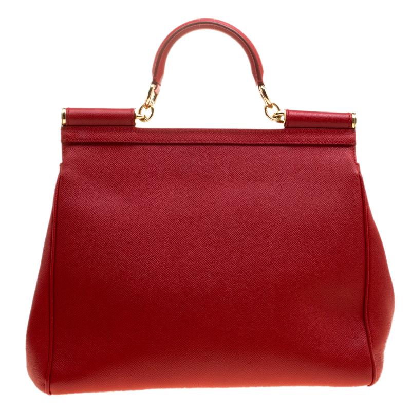 The Miss Sicily tote is one of the most celebrated creations from Dolce and Gabbana. The tote beautifully embodies the spirit of extravagance and feminity that the Italian luxury brand carries. Crafted from red leather, the tote has a structured