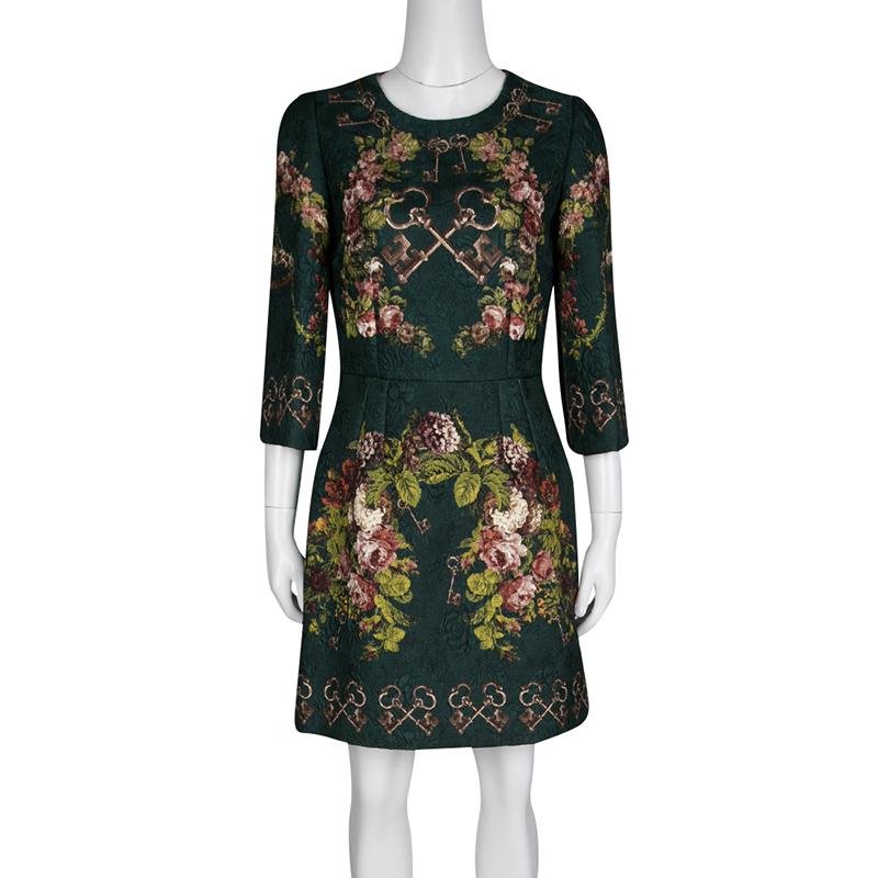 This Dolce and Gabbana dress is surely a wardrobe hero. The smartly updated bottle green hue and the comfy shape make this one a day-to-night piece. The floral and key print flatters lending the dress an urbane touch. Pair it with printed heels for