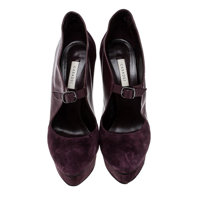 These eye catching and very statement Casadei platform pumps are not only unique and stylish but also very comfortable and versatile piece to add to your collection. Constructed in Bordeaux suede and leather, these panelled shoes a tiny buckle