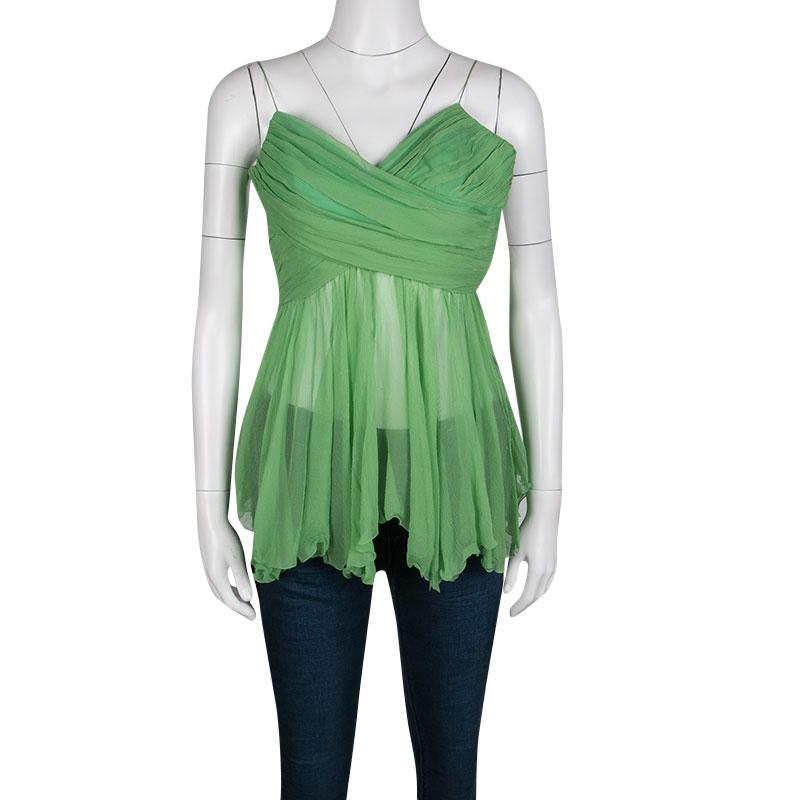 Add an elegant raise to your wardrobe basics through this beautiful green top from Chloe. Crafted in crinkled chiffon with pleats and noodle straps, the top features a draped design and is partially sheer. Team it up with fitted statement pants and