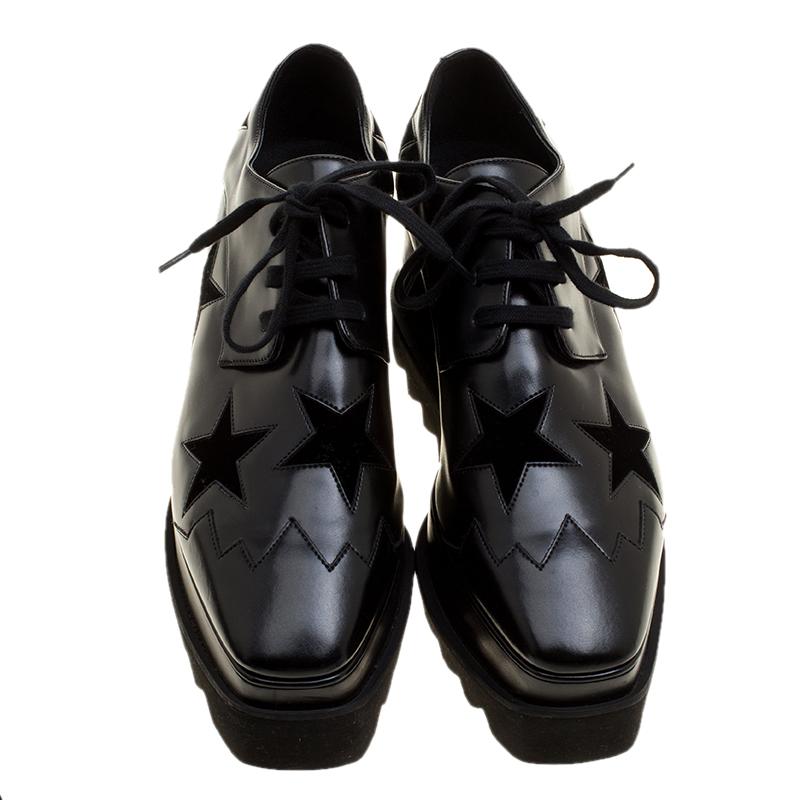 Jazz up your casual looks or add an edgy glam to your party outfits wearing these stunning Stella McCartney Elyse Star Derby shoes. Crafted in black faux leather and accented with black suede star shaped patches, these shoes feature thick black