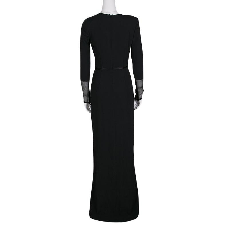 Tom Ford's maxi dress strikes a stunning balance between contemporary style and dreamy silhouette. This all-black dress has a wrapped front and comes with long sleeves that go sheer towards the end. It plunges down to a floor-sweeping length and