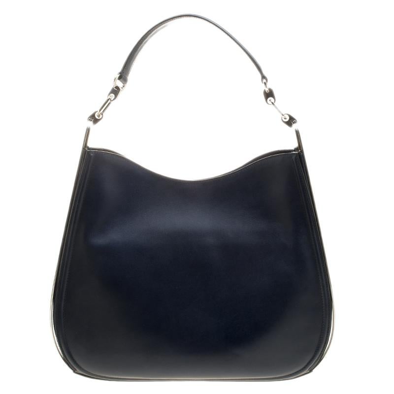 This cool, navy blue leather bag is crafted by Salvatore Ferragamo, a name that is popular amongst the fashion enthusiasts. Exhibiting a smooth finish, this one adds oodles of sophistication to your look. Highly durable and extremely classy, this