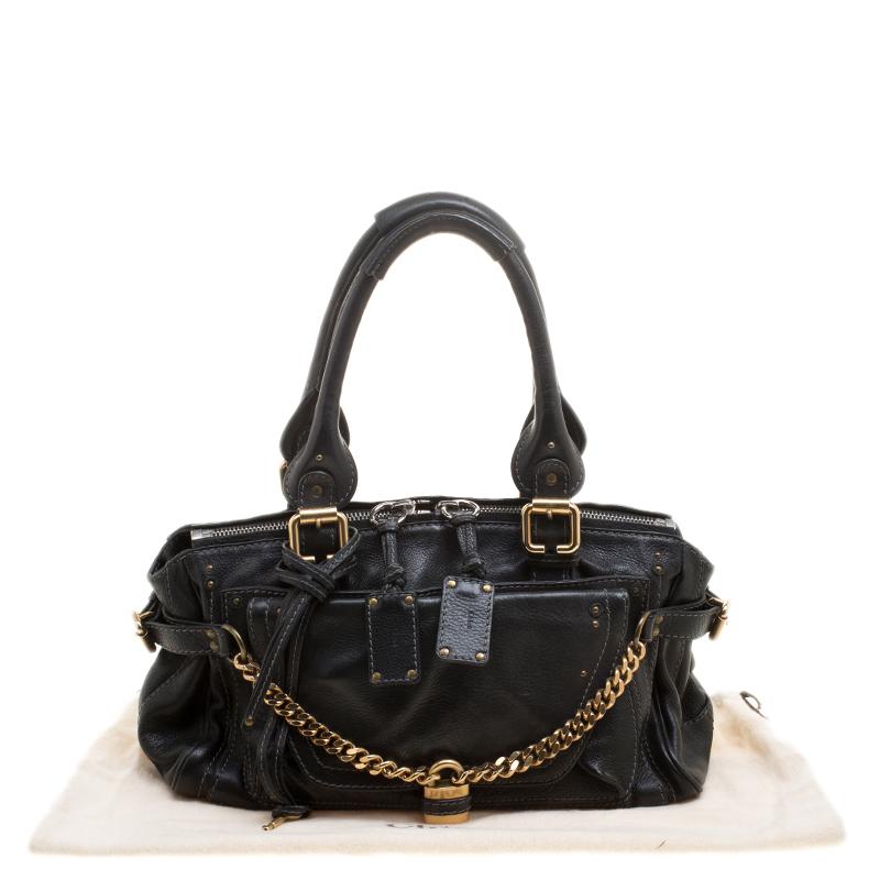 This Paddington Capsule satchel from the house of Chloe is designed from a black leather body and detailed with gold-tone accents. It features a petite silhouette and equipped with several pockets that can hold all your essentials and more. Carry it