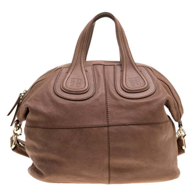 Make a remarkable appearance by adorning this posh brown leather bag. The standard fabric-lined interior and ornate exterior complement each other well making it a splendid pick of the season. This superb sleek creation from Givenchy will surely