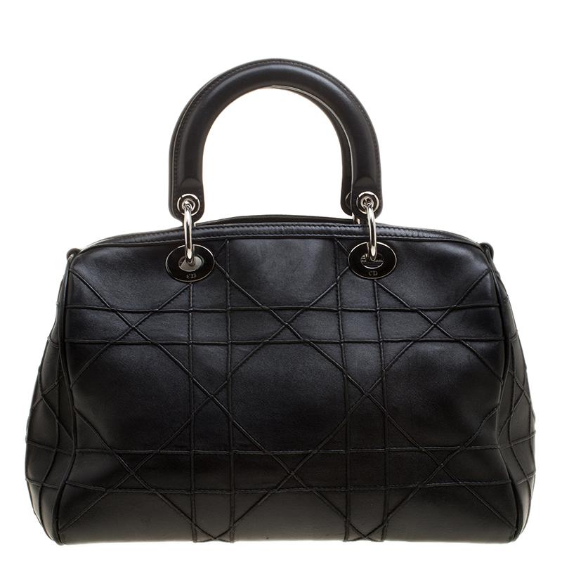 Fall in love instantly with this brilliant creation by Dior. Specially designed for the urban woman is this classic leather handbag with alluring features. Everything ranging from elegant design to breathtaking posh black color is just impeccable.