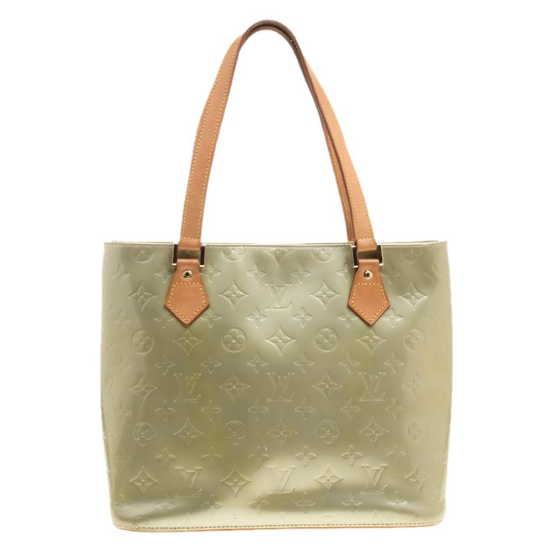 This contemporary green leather handbag by Louis Vuitton is all you need to complement your outfit. Complete your stylish look with this one. With leather lined interiors, this can hold more than just essentials.

Includes: The Luxury Closet