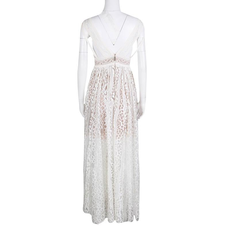 Elie Saab design their elegant evening wears with subtle hints of glamor. This white, sleeveless gown features lace embroidery throughout. It is styled with a beautiful neckline, cutout details on the shoulder straps, and falls in a flattering shape