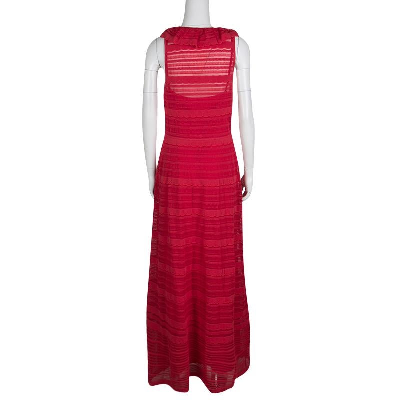This gorgeous red dress from M Missoni is designed to elevate your look during casual events. The cotton blend maxi dress has a sleeveless design, scallop detailing, and a ruffled neckline. Team it with a pair of metallic flats or heels for a