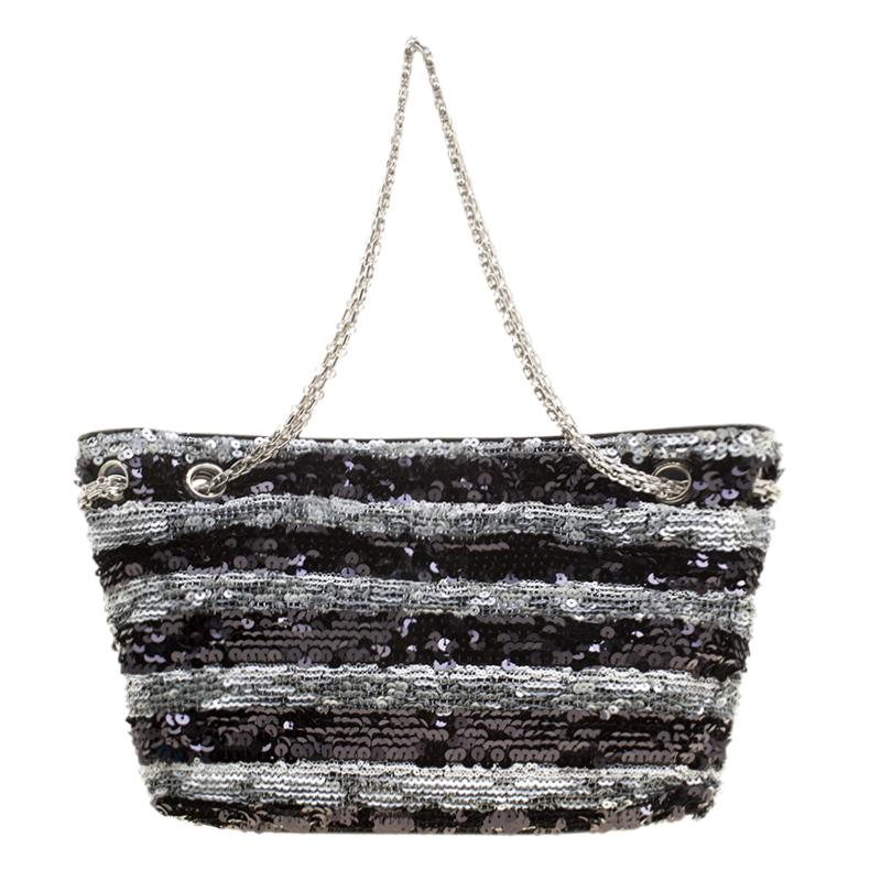 Add to your accessories collection with this lovely sequin black handbag. It will instantly elevate any simple look. This bag from Chanel with excellent satin lining is an ideal pick and will complement multiple styles of attire.

Includes: The