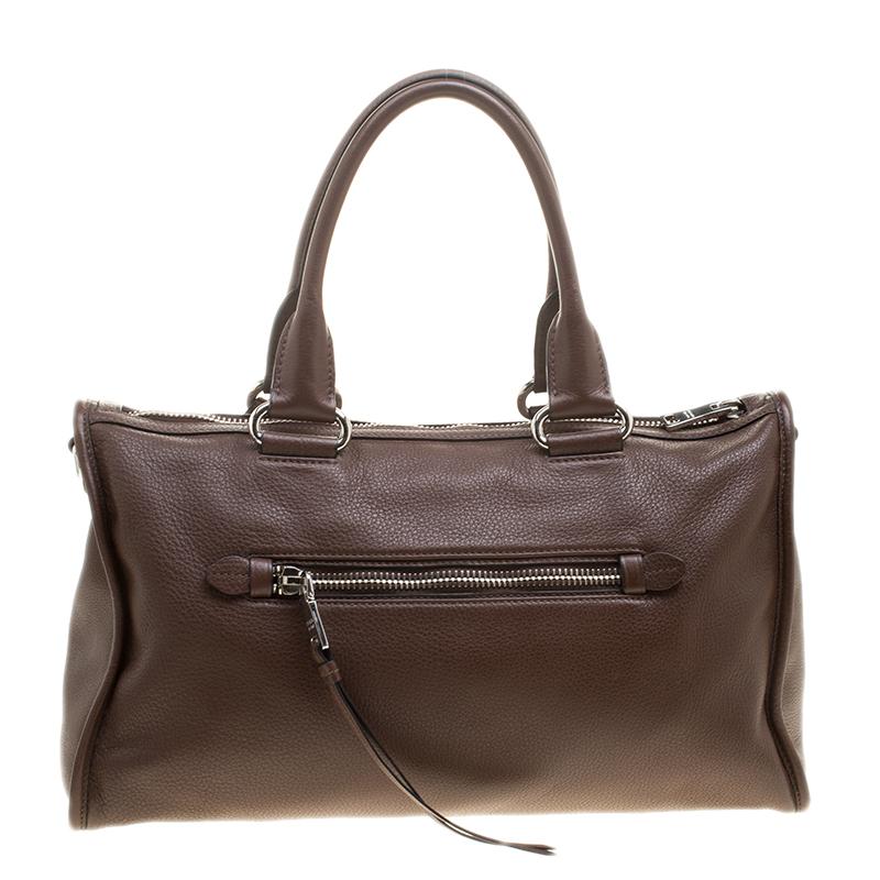 This sleek and sturdy, brown Prada tote is a symbol of style. The interior, lined with nylon, is capable of holding all your essentials and the two handles are for you to easily carry it. Made with leather, this is an excellent addition to turn up