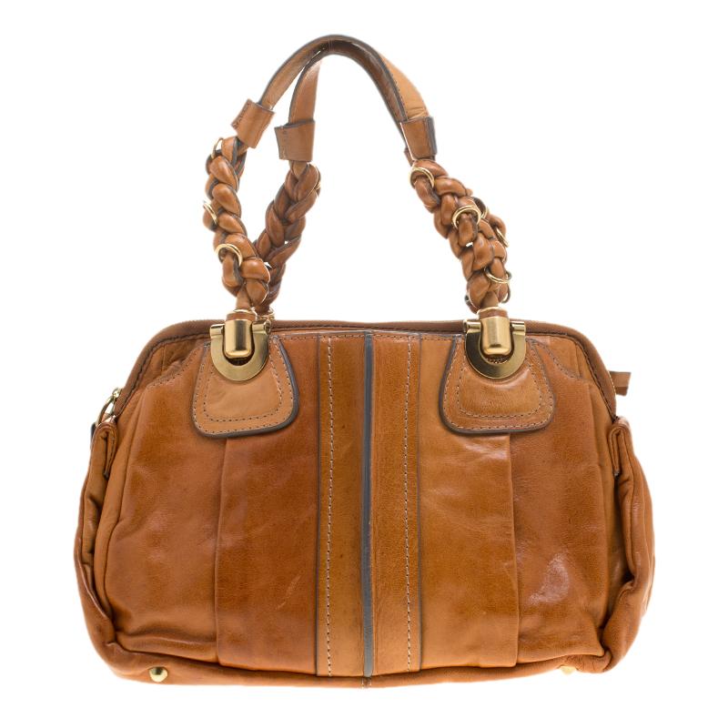 The standard fabric lined interior and extravagant exterior complement each other well making it a splendid pick of the season. This tan bag is stunning and gorgeous to look at. It goes well with any kind of attire. Fall in love with this absolutely