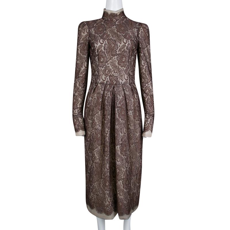 Designed for a vintage look, this brown dress is perfect for any formal event. Made from blended fabric, it has a scalloped lace overlay, long sleeves, and a padded high neck. This elegant piece from the house of Dolce&Gabbana can be worn with beige