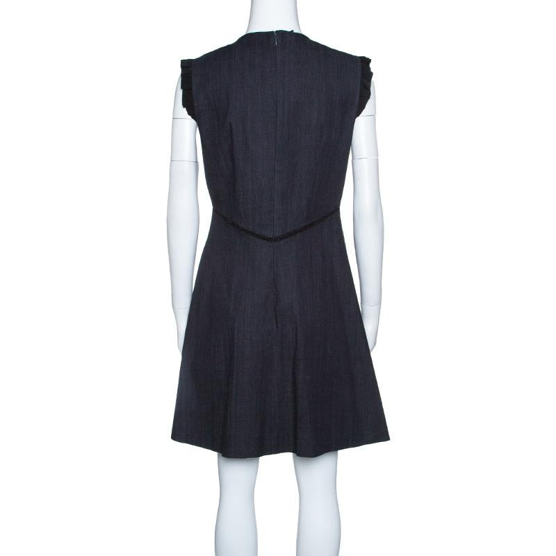 This sleeveless dress by Miu Miu exudes an understated style and elegance in ample proportions. It is cut to a lovely structure with contrasting lace inserts. The outfit comes with a stylish neck and a zip closure at the rear. Team this with