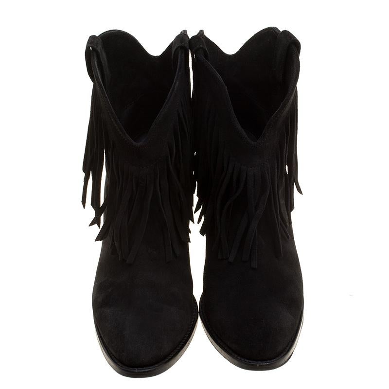 These ankle boots from Saint Laurent Paris are not only well-made but also distinct. Crafted from suede and styled as an ankle length, this pair features fringe detailing and 9 cm block heels. This creation is a definite must-have!

Includes: