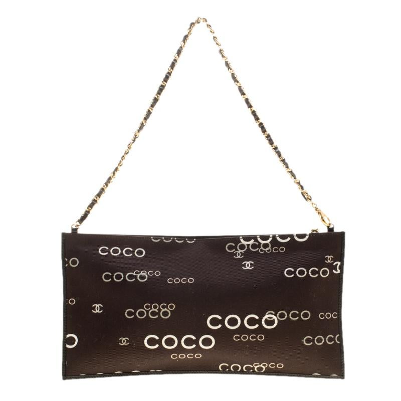 This chain pouch from Chanel just says luxury in every detail. It has COCO and the CC logo printed all over its fabric exterior, a zipper to secure the fabric interior and a leather chain handle for a hand or shoulder style.

Includes: Original