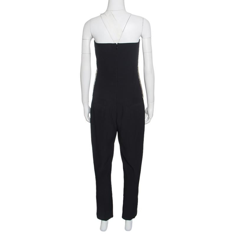 Alexander McQueen is known for its edgy designs and daring silhouettes. The label has a reputation of adding unique dimensions to clothing, and this jumpsuit proves that, just right. Cut to a skinny fit, the outfit carries a solid navy blue hue